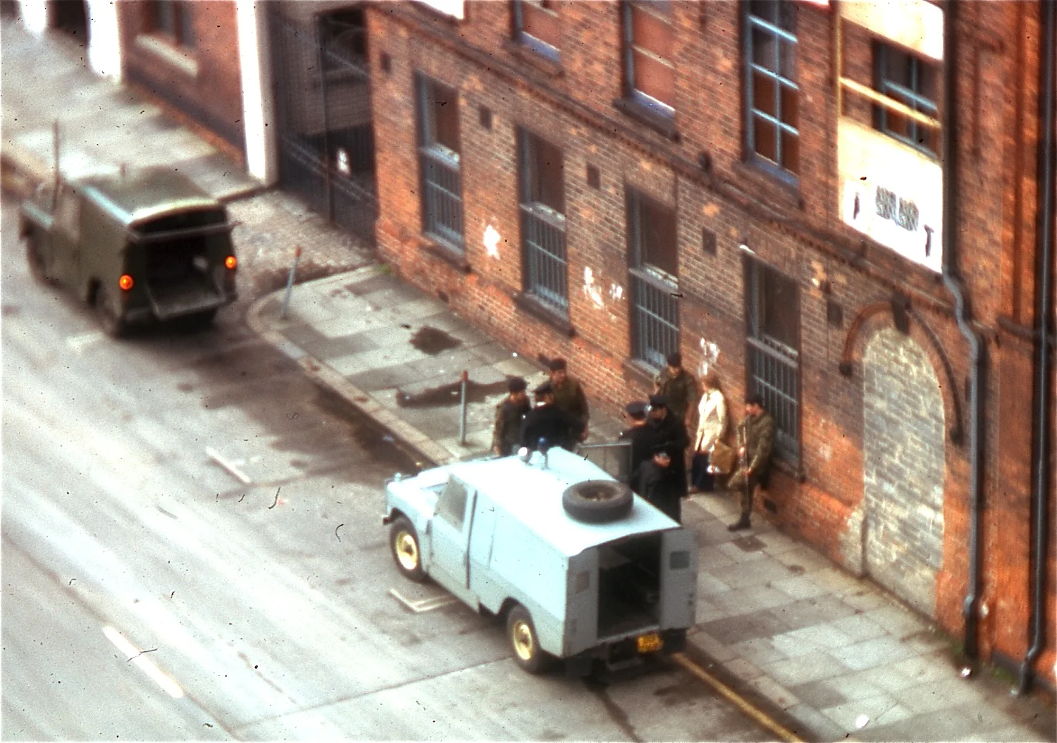 British troops investigate a couple on the street in Belfast — representative context visual. Shown from the cited image source.